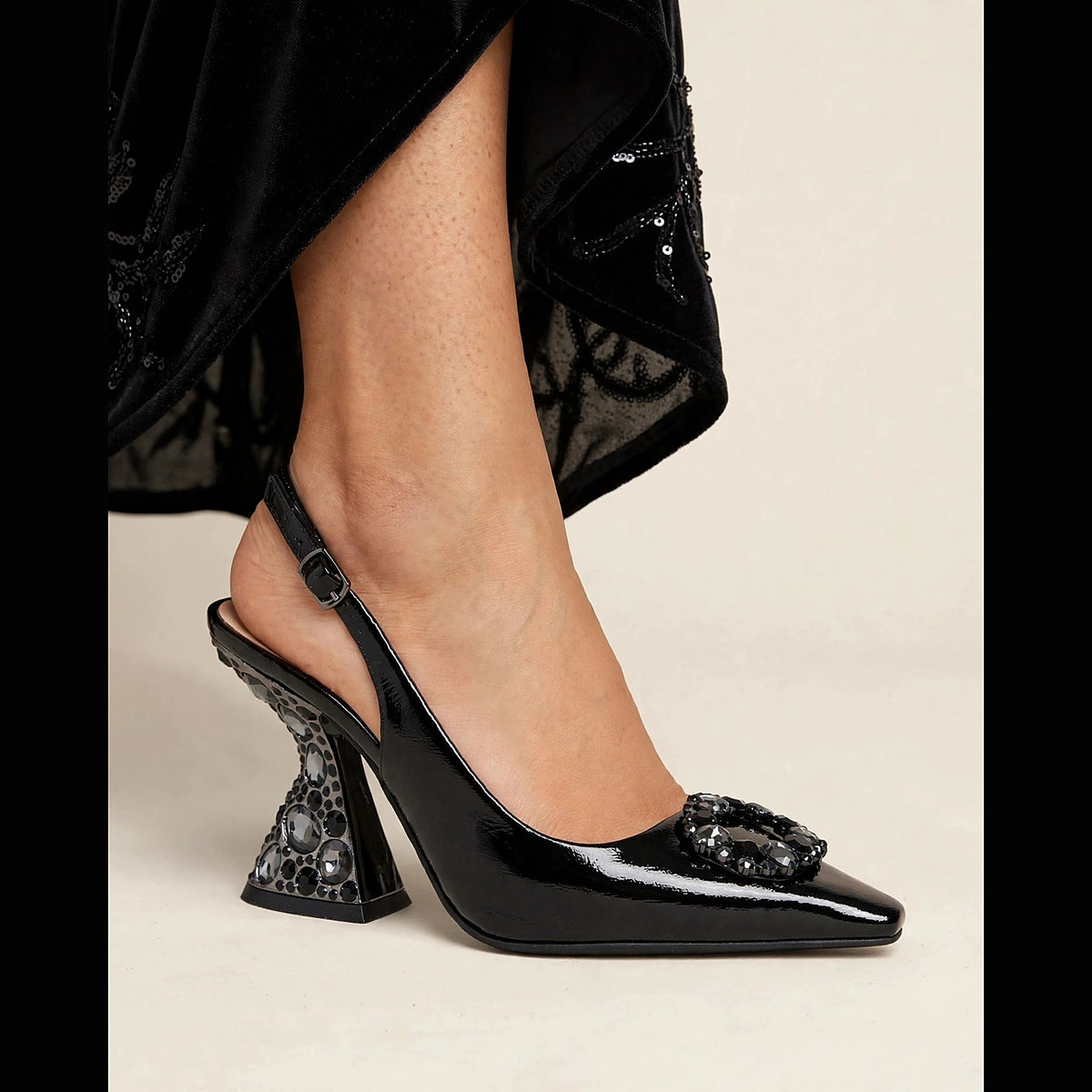 Bijou Jeweled Pumps in black - patent slingback pump with crystal medallion and jeweled sculptural heel, worn on foot