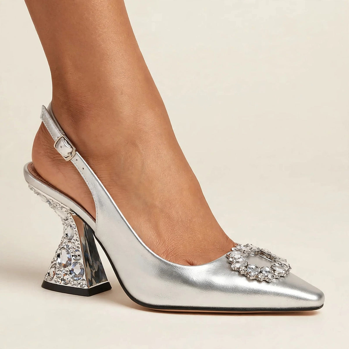 Bijou Jeweled Pumps in silver - patent slingback pump with crystal medallion and jeweled sculptural heel, worn on foot