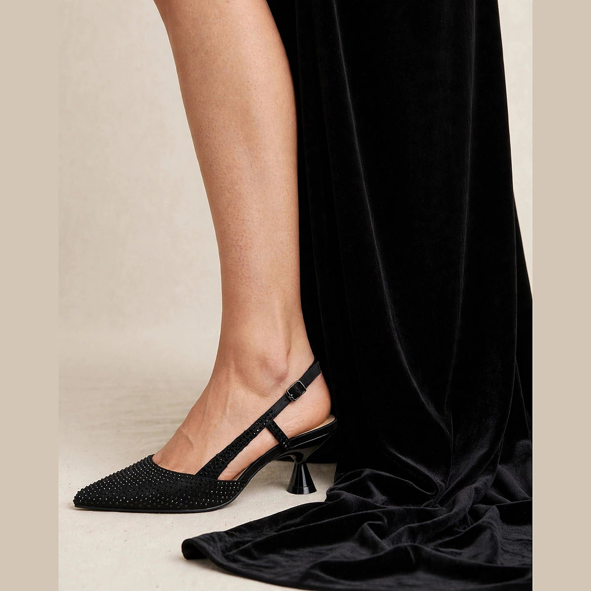 Noir Crystal Slingback in black - rhinestone pointed-toe slingback pump with spool heel, worn on foot