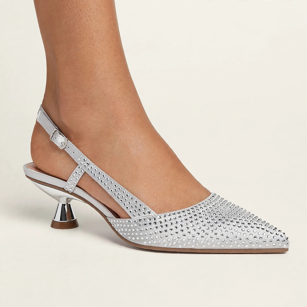Noir Crystal Slingback in silver - rhinestone pointed-toe slingback pump with spool heel, worn on foot